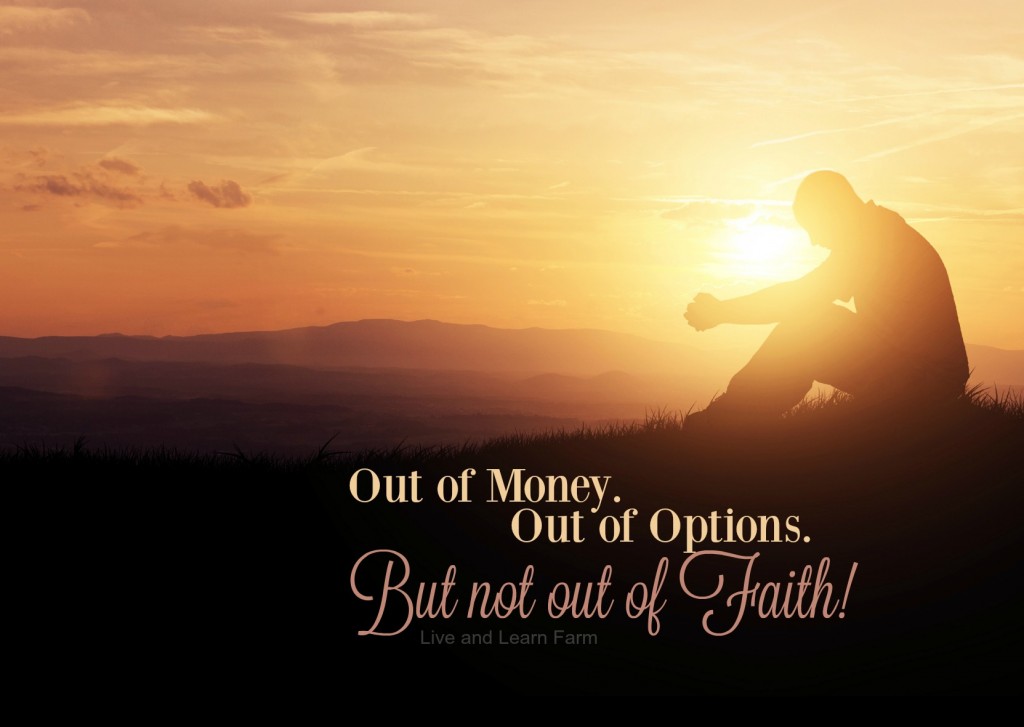 Man praying as the sun rises in the mountains.